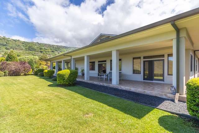 82-1171 Meli Rd, Captain Cook, HI 96704 - view of green lawn with a patio area