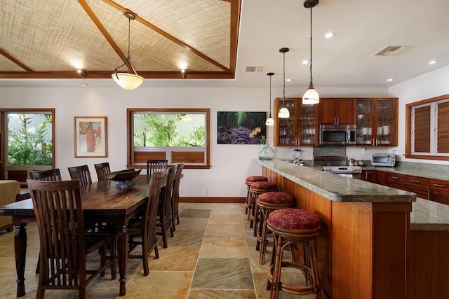 69-1648 Puako Beach Dr, Kamuela, HI 96743 - dining room featuring healthy amount of natural light, baseboards, and recessed lighting