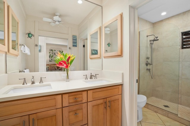 2253 Poipu Rd Unit 168, Koloa, HI 96756 - full bathroom featuring tiled shower, double vanity, toilet, tile patterned flooring, and a ceiling fan