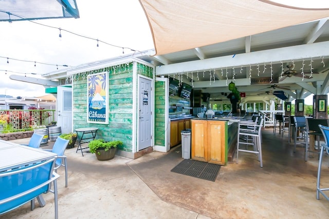 2253 Poipu Rd Unit 168, Koloa, HI 96756 - view of patio with ceiling fan and exterior bar