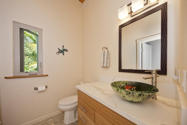 12-7002 Hoeunalu St, Pahoa, HI 96778 - half bath with vanity, toilet, and baseboards
