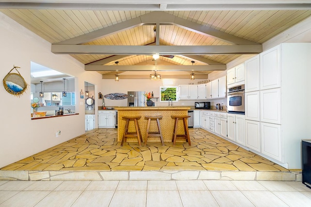 77-6469 Marlin Rd, Kailua-Kona, HI 96740 - kitchen with appliances with stainless steel finishes, white cabinetry, a sink, and wooden ceiling