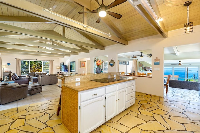 77-6469 Marlin Rd, Kailua-Kona, HI 96740 - kitchen with a ceiling fan, open floor plan, wooden ceiling, black electric stovetop, and white cabinetry