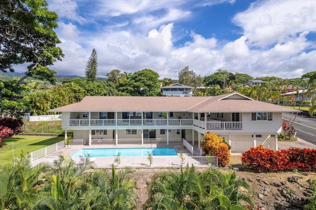75-389 Hoene St, Kailua-Kona, HI 96740 - back of house with an outdoor pool and a patio