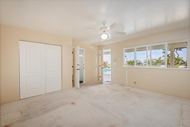 75-389 Hoene St, Kailua-Kona, HI 96740 - unfurnished bedroom featuring carpet flooring, a closet, and ceiling fan