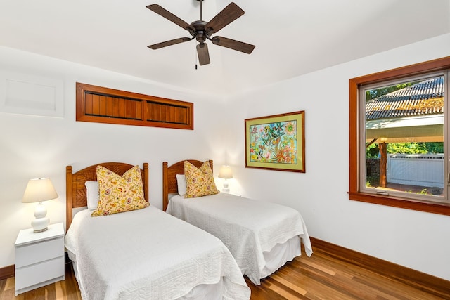 69-1708 Puako Beach Dr, Kamuela, HI 96743 - bedroom featuring wood finished floors, baseboards, ceiling fan, and cooling unit