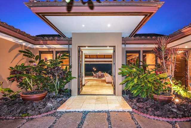 78-7024 Ola Mau St, Kailua-Kona, HI 96740 - property entrance with a tiled roof and stucco siding