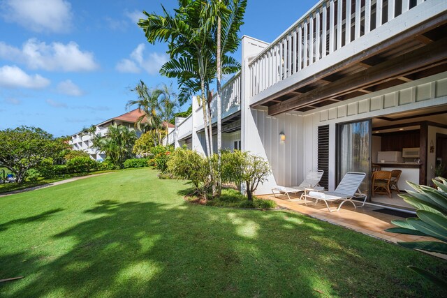 2253 Poipu Rd Unit 101, Koloa, HI 96756 - view of grassy yard featuring a balcony
