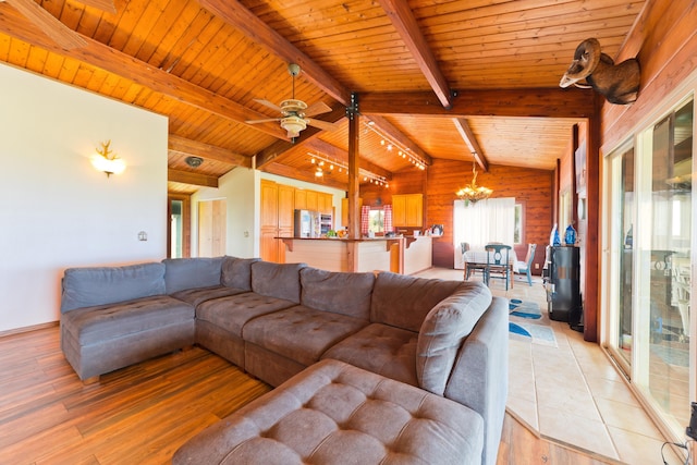 93-7015 Kamaoa Rd, Naalehu, HI 96772 - living room with wooden ceiling, a chandelier, light wood finished floors, and wooden walls