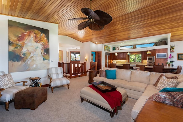 68-1025 Kaniku Dr Unit 301, Kamuela, HI 96743 - living area with wood ceiling, plenty of natural light, vaulted ceiling, a ceiling fan, and light colored carpet