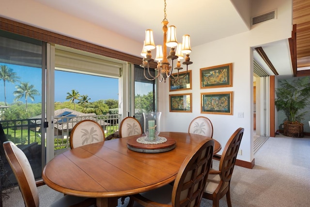 68-1025 Kaniku Dr Unit 301, Kamuela, HI 96743 - carpeted dining space with a chandelier and baseboards