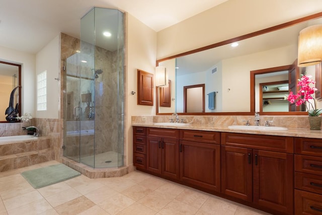68-1025 Kaniku Dr Unit 301, Kamuela, HI 96743 - bathroom featuring double vanity, a stall shower, a garden tub, tile patterned flooring, and recessed lighting