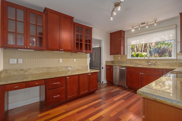 99-1775 Pukeawe Cir, Volcano, HI 96785 - kitchen with appliances with stainless steel finishes, a sink, reddish brown cabinets, dark wood-style flooring, and decorative backsplash