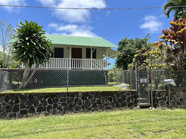 588-A Akahai Pl, Hilo, HI 96720 - view of front of home featuring a gate, metal roof, and covered porch
