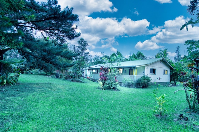 13-979 Kahukai St, Pahoa, HI 96778 - view of front of house with a porch, metal roof, and a front yard