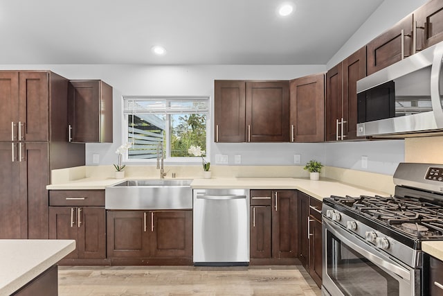 16-2170 Treefern Dr, Pahoa, HI 96778 - kitchen with appliances with stainless steel finishes, a sink, light countertops, recessed lighting, and dark brown cabinets