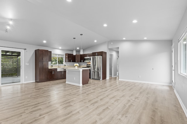 16-2170 Treefern Dr, Pahoa, HI 96778 - kitchen featuring appliances with stainless steel finishes, open floor plan, light countertops, dark brown cabinetry, and lofted ceiling