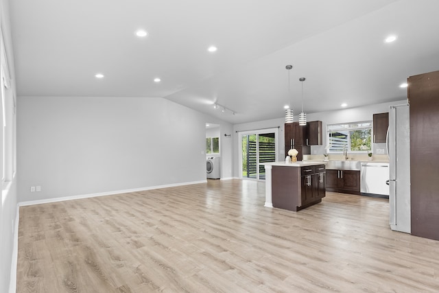 16-2170 Treefern Dr, Pahoa, HI 96778 - kitchen with washer / clothes dryer, appliances with stainless steel finishes, dark brown cabinetry, light countertops, and healthy amount of natural light