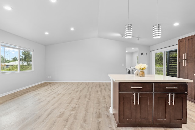 16-2170 Treefern Dr, Pahoa, HI 96778 - kitchen with washer and clothes dryer, light countertops, light wood finished floors, recessed lighting, and pendant lighting