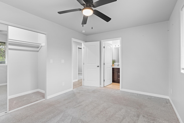 16-2170 Treefern Dr, Pahoa, HI 96778 - unfurnished bedroom featuring light carpet, baseboards, a closet, a ceiling fan, and ensuite bath