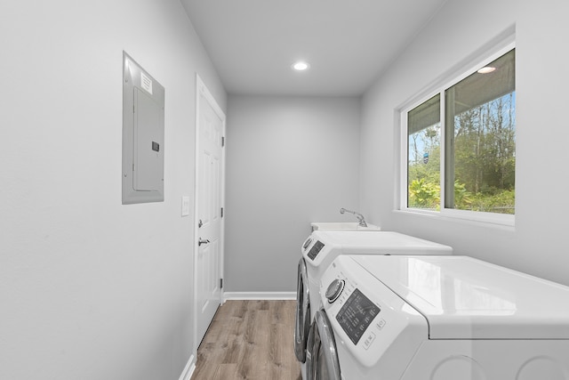 16-2170 Treefern Dr, Pahoa, HI 96778 - washroom featuring electric panel, independent washer and dryer, light wood-style flooring, recessed lighting, and baseboards