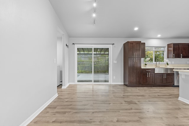 16-2170 Treefern Dr, Pahoa, HI 96778 - kitchen featuring light countertops, light wood-style flooring, dark brown cabinetry, recessed lighting, and baseboards