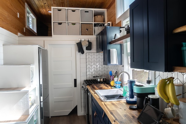 16-1961 Silversword Ct, Pahoa, HI 96778 - kitchen featuring wooden counters, blue cabinetry, a sink, open shelves, and wood ceiling