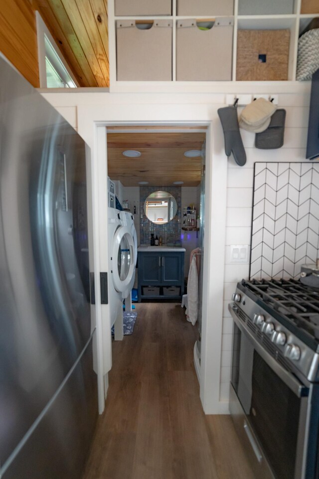 16-1961 Silversword Ct, Pahoa, HI 96778 - laundry room with dark wood-style flooring and washer / clothes dryer