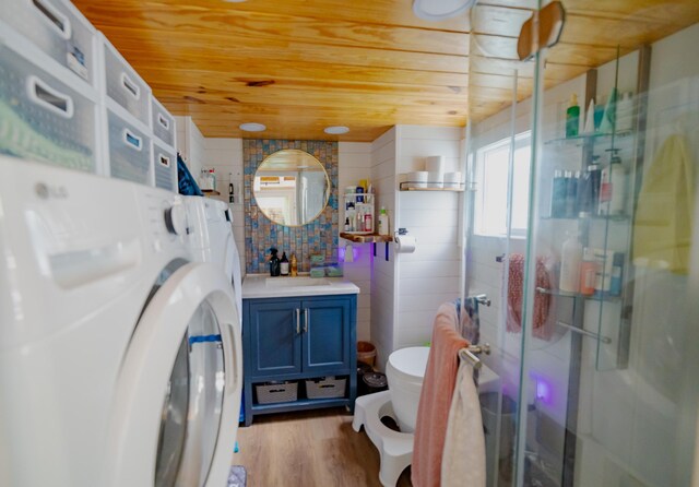 16-1961 Silversword Ct, Pahoa, HI 96778 - full bathroom featuring washer / dryer, wood ceiling, vanity, a shower stall, and wood finished floors