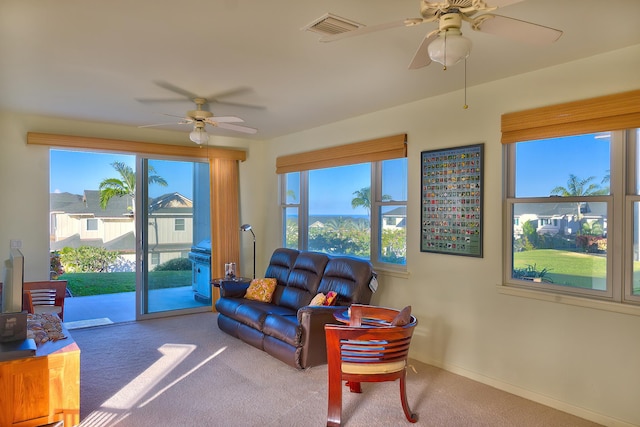 78-6833 Alii Dr Unit E5, Kailua-Kona, HI 96740 - carpeted living room with ceiling fan, plenty of natural light, and baseboards
