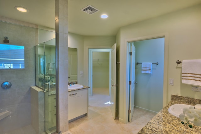 78-6833 Alii Dr Unit E5, Kailua-Kona, HI 96740 - full bath featuring vanity, a stall shower, a spacious closet, tile patterned floors, and recessed lighting