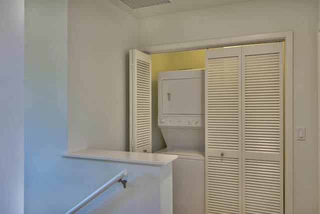 78-6833 Alii Dr Unit E5, Kailua-Kona, HI 96740 - laundry room featuring stacked washer / drying machine