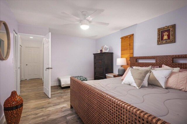 76-6304 Haku Pl, Kailua-Kona, HI 96740 - bedroom featuring wood finished floors, ceiling fan, and baseboards