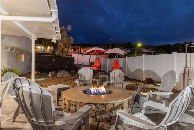 76-6304 Haku Pl, Kailua-Kona, HI 96740 - patio at night with a fire pit and a fenced backyard