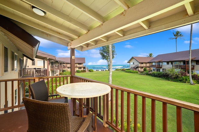5-7130 Kuhio Hwy Unit C4, Hanalei, HI 96722 - wooden terrace with a water view and a lawn
