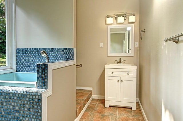 13-1020 Kahukai St, Pahoa, HI 96778 - bathroom with vanity, stone finish flooring, and baseboards