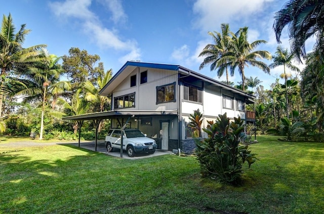 13-1020 Kahukai St, Pahoa, HI 96778 - view of property exterior featuring a carport and a yard