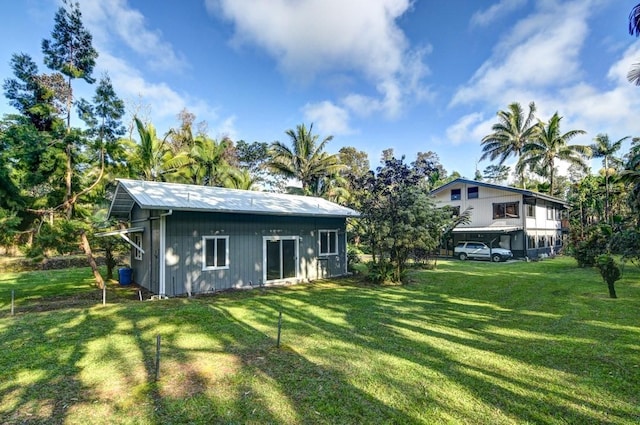 13-1020 Kahukai St, Pahoa, HI 96778 - rear view of house featuring a lawn