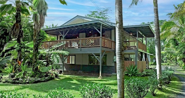 13-1020 Kahukai St, Pahoa, HI 96778 - rear view of house featuring a deck and a yard