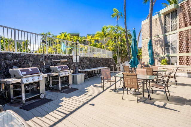 75-6016 Alii Dr Unit 211, Kailua-Kona, HI 96740 - wooden deck featuring area for grilling and outdoor dining space