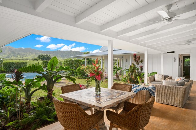 7465-C Koolau Rd, Kilauea, HI 96754 - view of patio / terrace with a ceiling fan, an outdoor living space, a mountain view, and outdoor dining area
