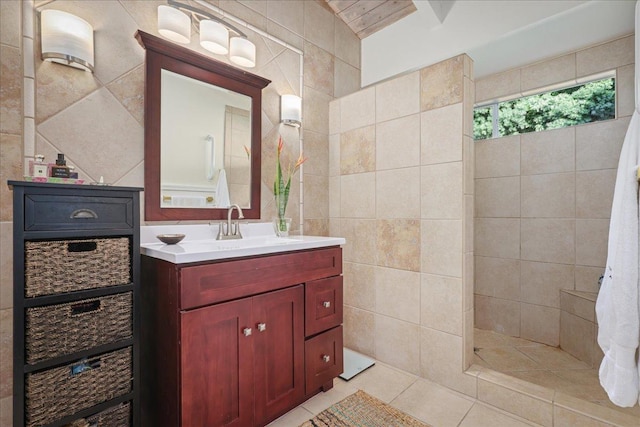 76-6309 Haku Pl, Kailua-Kona, HI 96740 - bathroom featuring tile walls, vanity, a walk in shower, and tile patterned floors