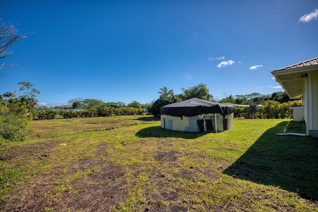 15-1849 14th Ave, Keaau, HI 96749 - view of green lawn with an outdoor structure