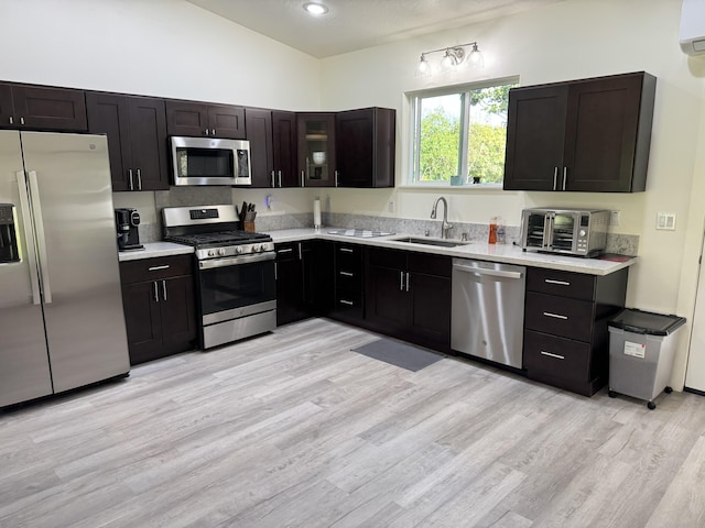 15-2797 Lai St, Pahoa, HI 96778 - kitchen featuring stainless steel appliances, a sink, light countertops, light wood finished floors, and lofted ceiling