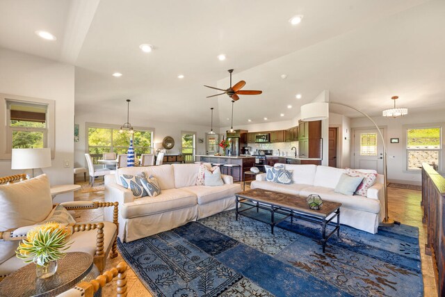 3170 E Iwipoo Rd Unit 2, Kalaheo, HI 96741 - living area with recessed lighting, lofted ceiling, ceiling fan, a chandelier, and baseboards
