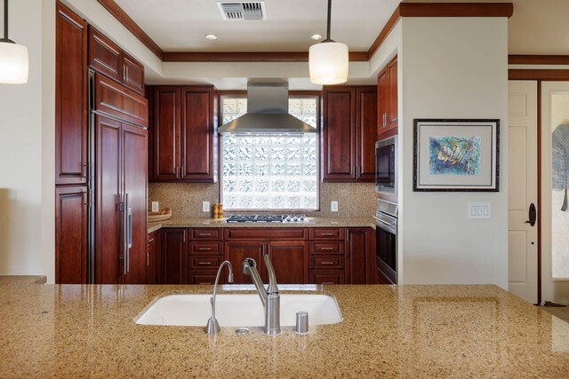 62-3600 Amaui Pl Unit K202, Kamuela, HI 96743 - kitchen featuring wall chimney range hood, built in appliances, dark brown cabinets, light stone counters, and decorative light fixtures
