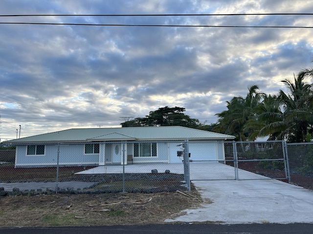 15-1746 7th Ave, Keaau, HI 96749 - view of front of property with concrete driveway, a fenced front yard, and metal roof