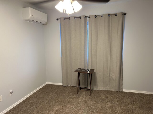 15-1746 7th Ave, Keaau, HI 96749 - spare room featuring an AC wall unit, dark colored carpet, a ceiling fan, and baseboards