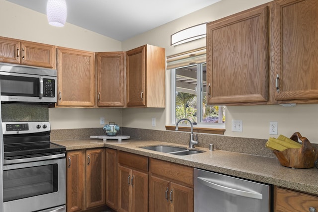 15-1987 30th Ave, Keaau, HI 96749 - kitchen featuring appliances with stainless steel finishes, a sink, lofted ceiling, and brown cabinetry