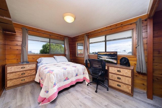 1890 Kaiao St, Hilo, HI 96720 - bedroom with light wood-style flooring and wooden walls